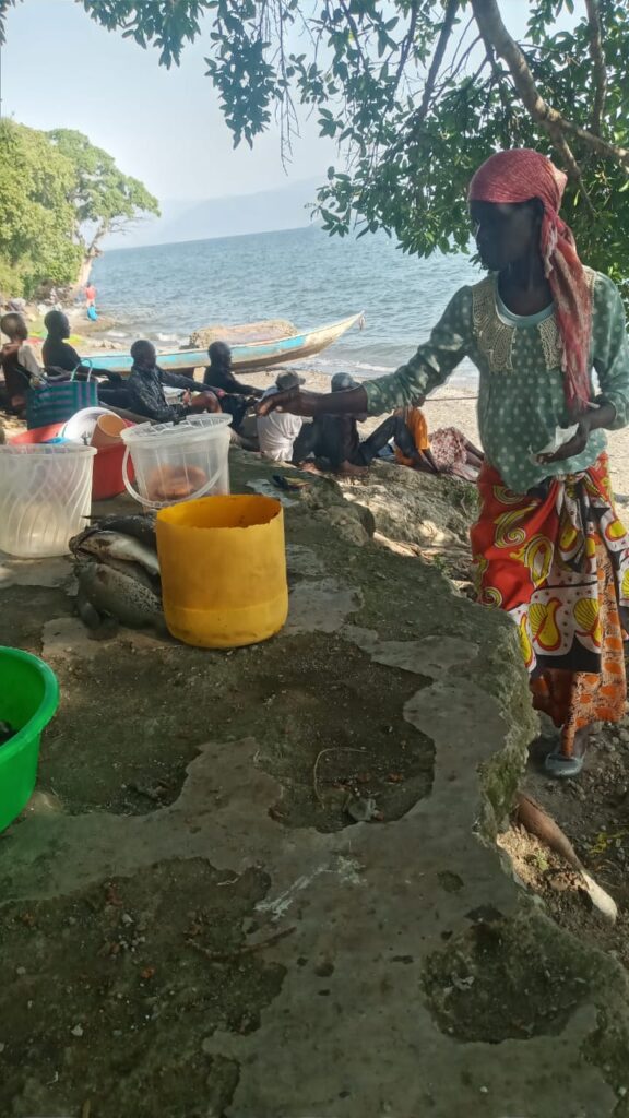 Woman preparing fish for sale